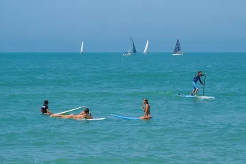 North Jetty: Surfers and Sailors
