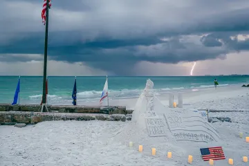 Lightning Behind 9/11 Memorial on Siesta Beach