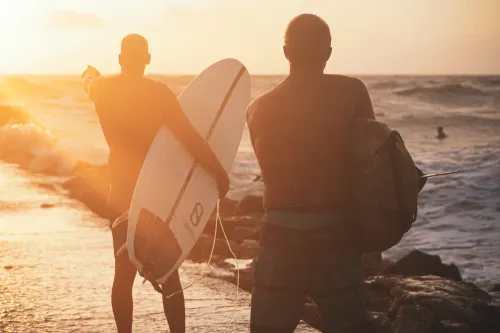 Surfers on the North Jetty