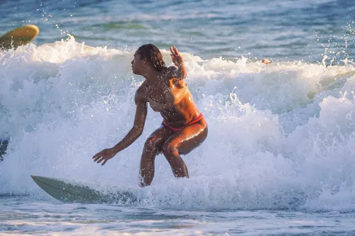 Lindsay Surfing with the Setting Sun