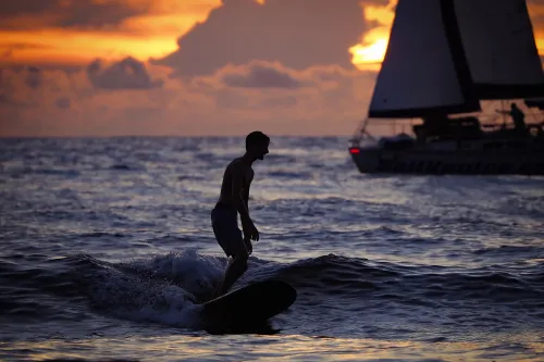 Sunset Surfing @ North Jetty, Sailboat in Background