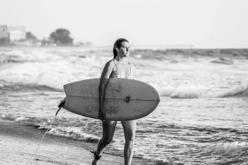 Venice, Florida: Black and White Surfer on the Beach