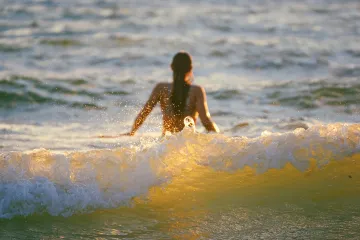 Surfergirl in the Waves